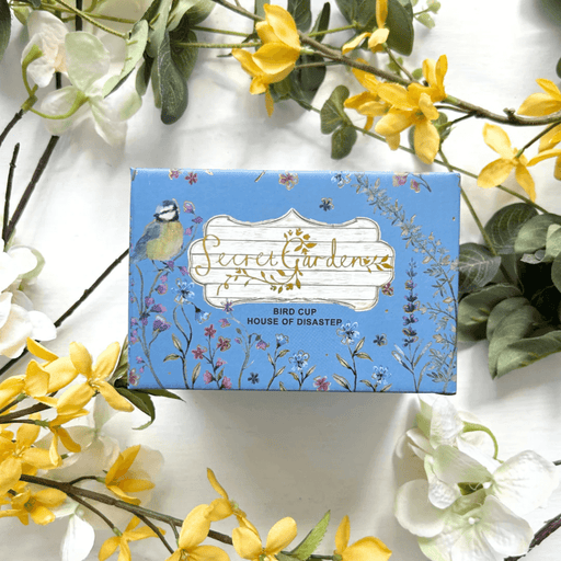 Front of the printed gift box with Secret Garden artwork and Bird Cup label