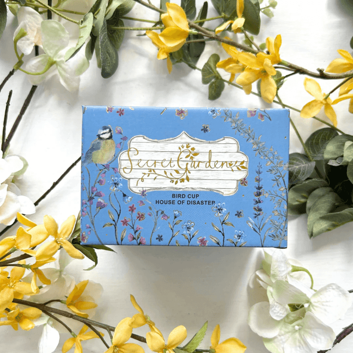 Front of the printed gift box with Secret Garden artwork and Bird Cup label