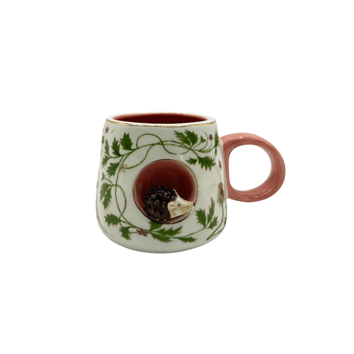 Front view of the Secret Garden 3D Hedgehog Cup with pink handle, foliage print and gold-foil rim