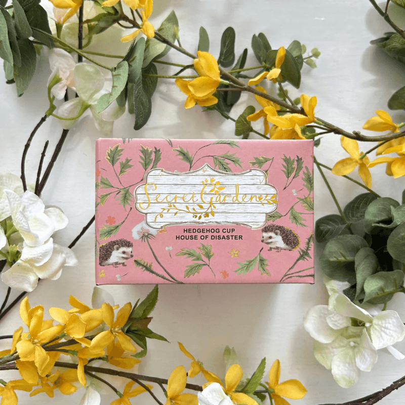 Front of the printed gift box with Secret Garden artwork and Hedgehog Cup label