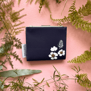 House of Disaster Secret Garden Bird Purse, back view with white floral print on pink background