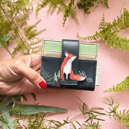 House of Disaster Secret Garden Fox Foldover Cardholder held in hand, showing fox design