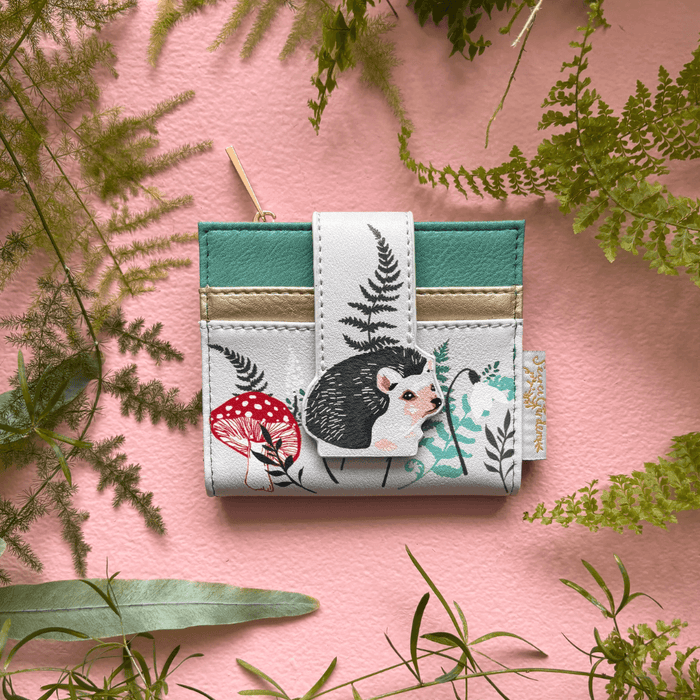 House of Disaster Secret Garden Hedgehog Purse foldover cardholder, front view on pink background
