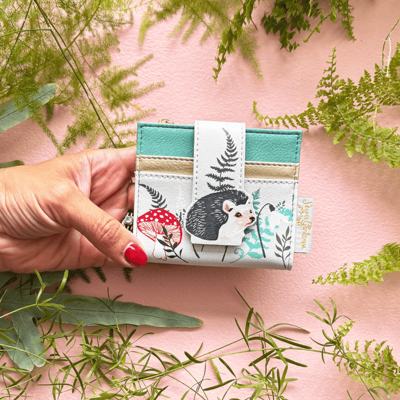 House of Disaster Secret Garden Hedgehog Purse held in hand, showing hedgehog design