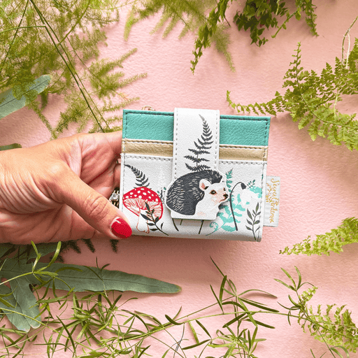 House of Disaster Secret Garden Hedgehog Purse held in hand, showing hedgehog design