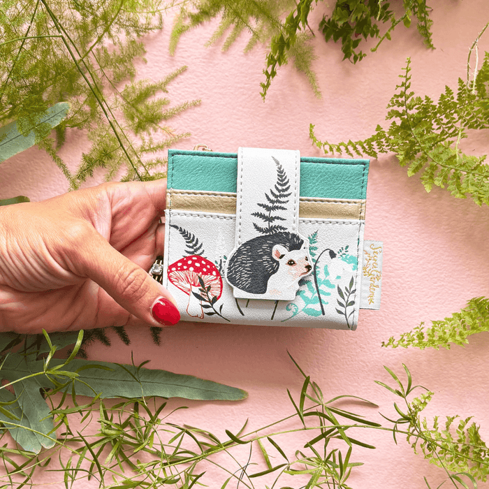 House of Disaster Secret Garden Hedgehog Purse held in hand, showing hedgehog design