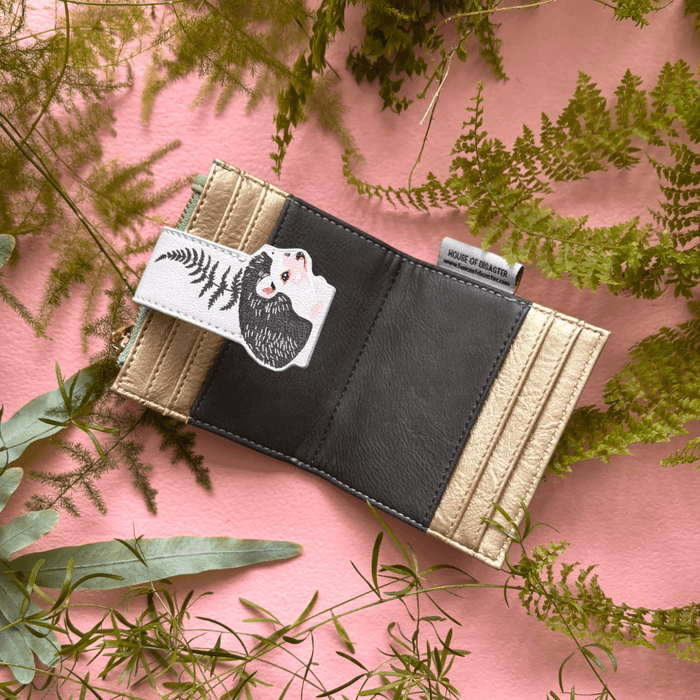 House of Disaster Secret Garden Hedgehog Purse open, showing interior card slots on pink background