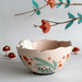 Lifestyle photo of the Secret Garden Rabbit Bowl styled with floral decor