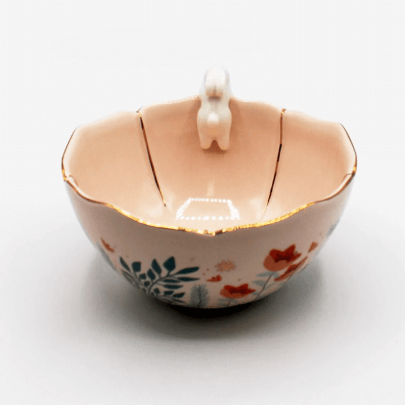 Side view showing the colourful foliage print and gold detailing on the outside