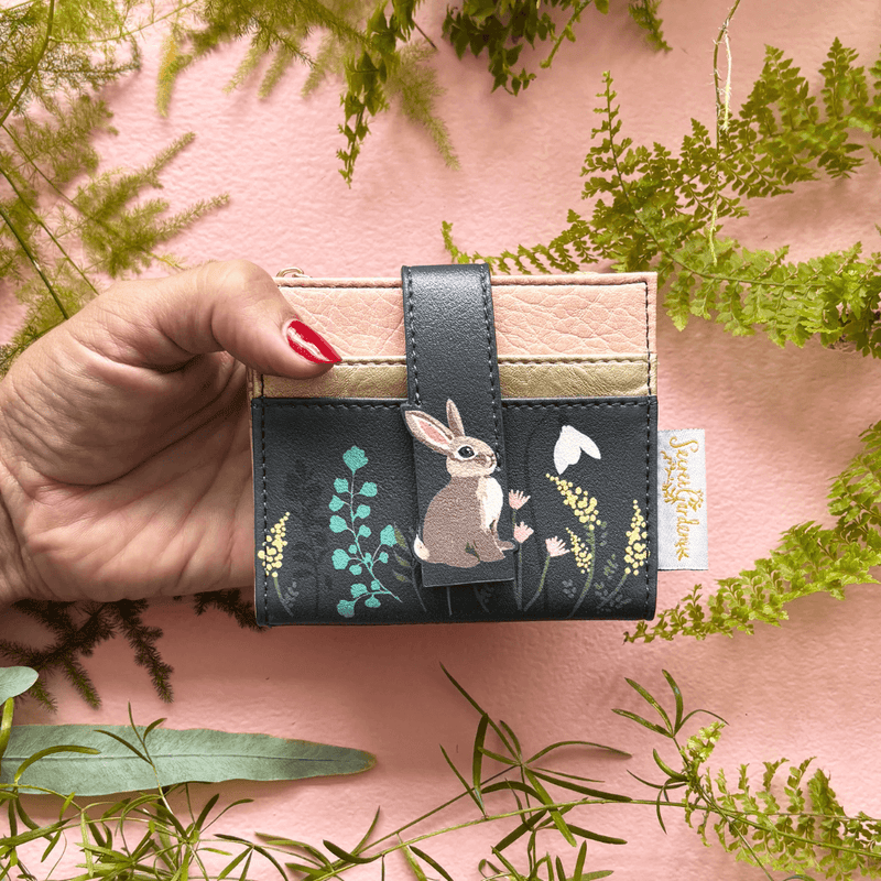 House of Disaster Secret Garden Rabbit Purse held in hand, showing rabbit design