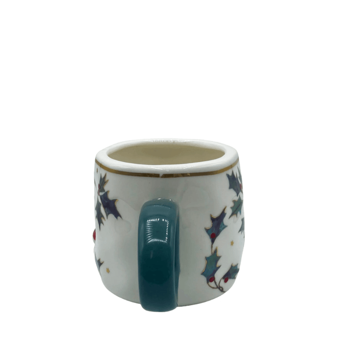 Rear view focusing on the green handle and holly print on the side