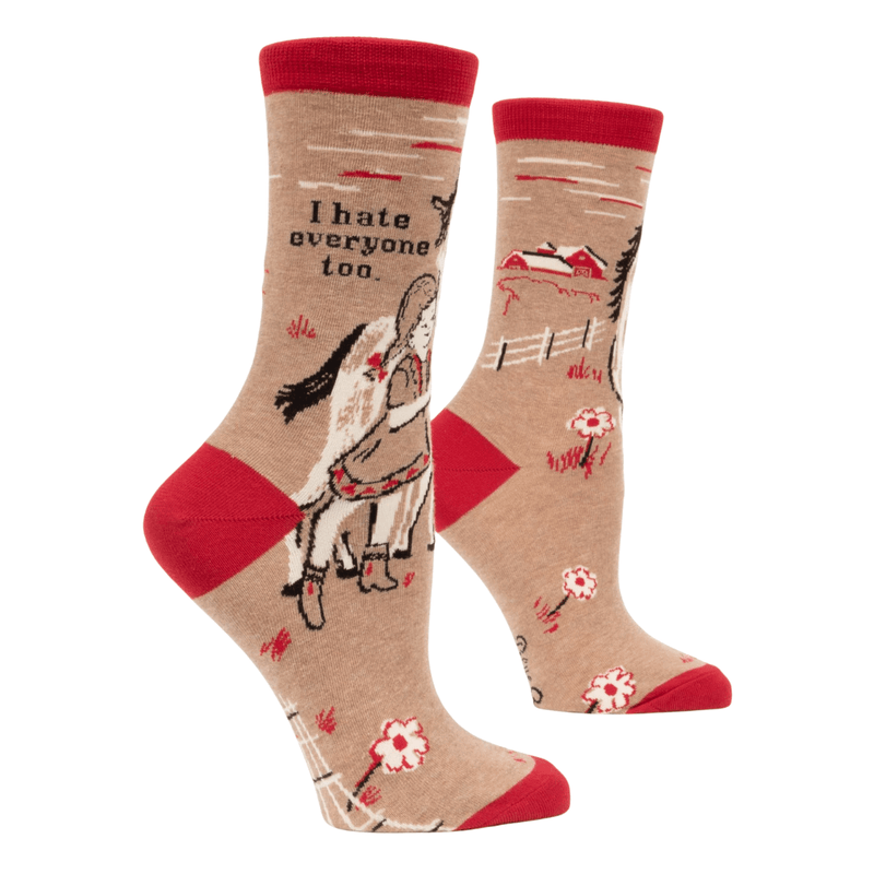 Funny crew socks with a girl hugging a horse and the phrase “I hate everyone too,” in red and beige tones.