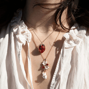 Bill Skinner Strawberry & Mouse Locket Necklace layered with another necklace