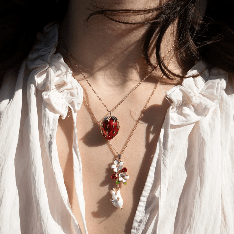 Bill Skinner Strawberry & Mouse Locket Necklace layered with another necklace