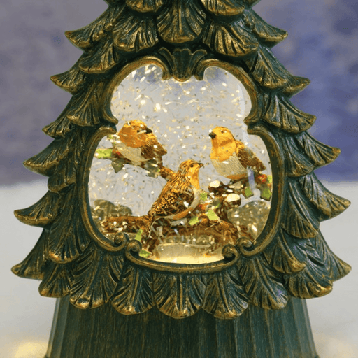 Close-up of illuminated robin Christmas tree water spinner with swirling glitter