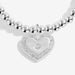 Close-up of Joma Jewellery heart charm with crystal-style halo and tiny star detail on a silver-plated beaded Bracelet.