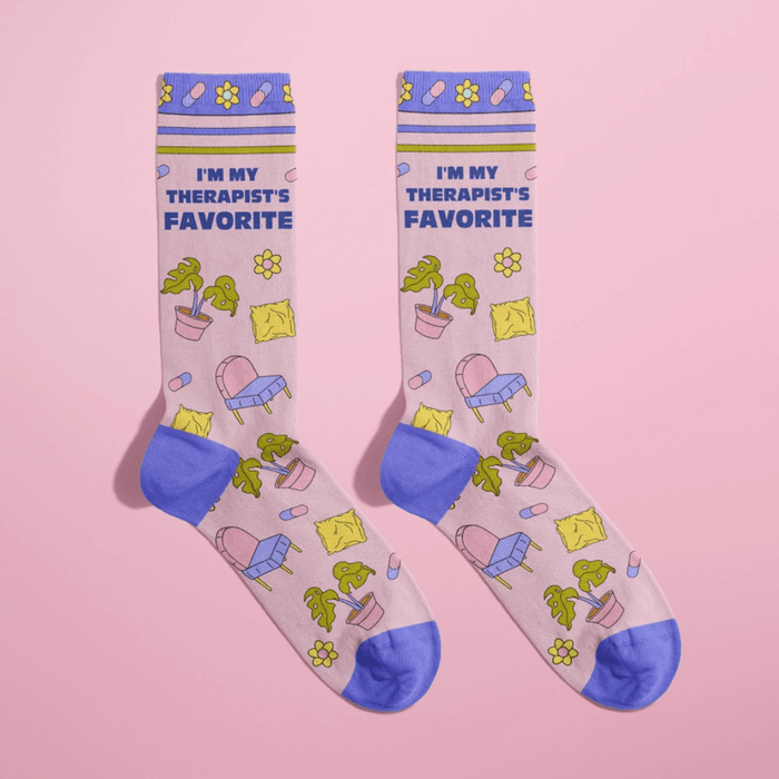 Pair of pastel I’m My Therapist’s Favourite women’s crew socks with plants, chairs and pill icons