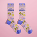 Pair of pastel I’m My Therapist’s Favourite women’s crew socks with plants, chairs and pill icons