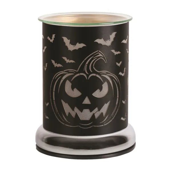 Unlit pumpkin-themed electric wax melt burner with black metal finish

