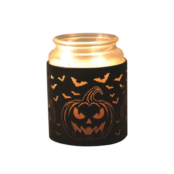 Jar candle inside Halloween wax burner with pumpkin and bats cut-out design

