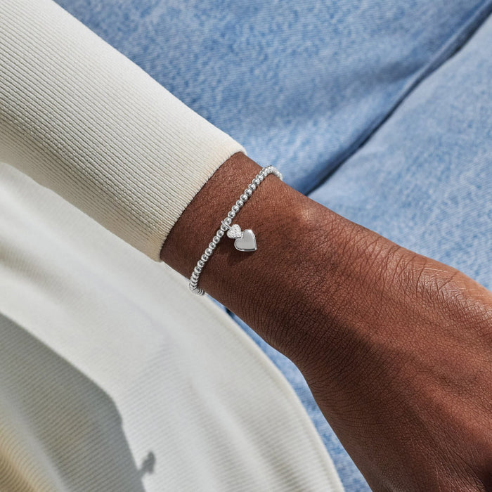 Silver-plated beaded Bracelet worn on wrist with double heart charm for best little sister gift