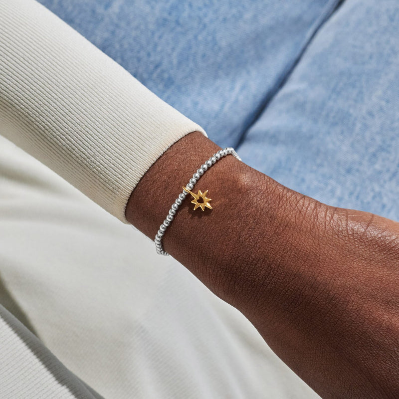 Joma A Little Good Energy Bracelet worn on wrist
