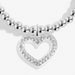 Close-up of Joma A Little Happy Birthday Sister Bracelet charm, silver open heart with crystal detail on beaded Bracelet.
