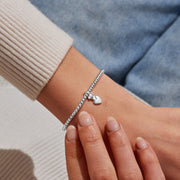 Silver-plated beaded Bracelet worn on wrist with dog and heart charm for dog mum gift