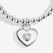 Close-up of Joma Jewellery silver heart charm with a tiny crystal heart centre on a silver-plated beaded Bracelet.