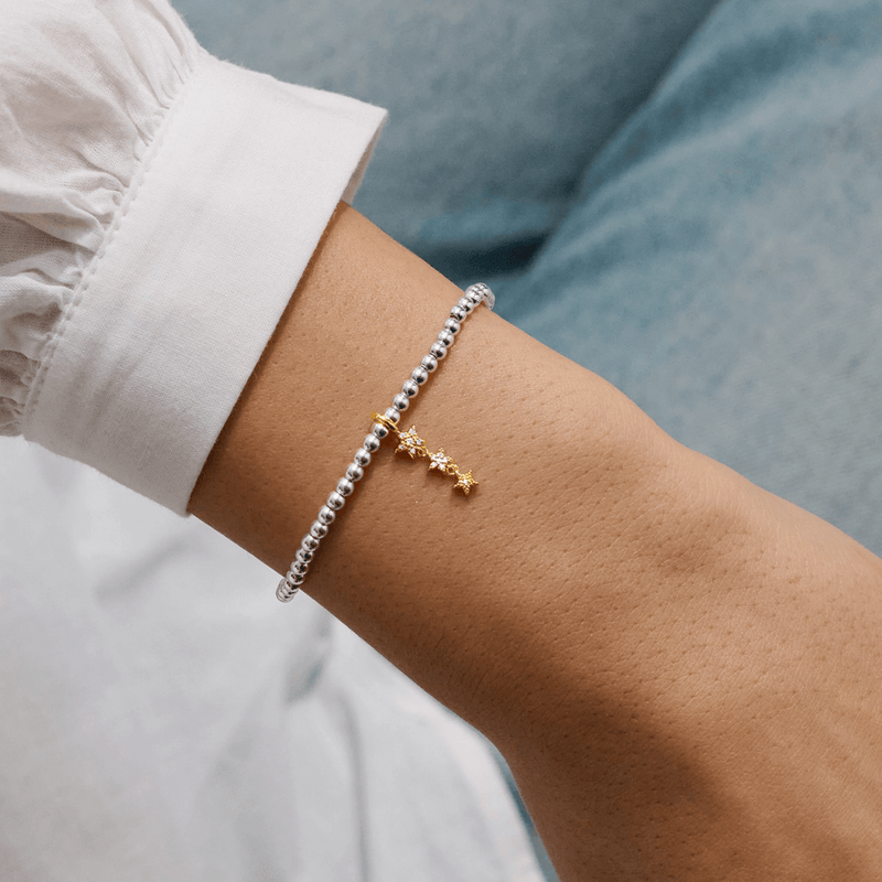 Joma Jewellery Magical Birthday Wish star bracelet worn on a wrist