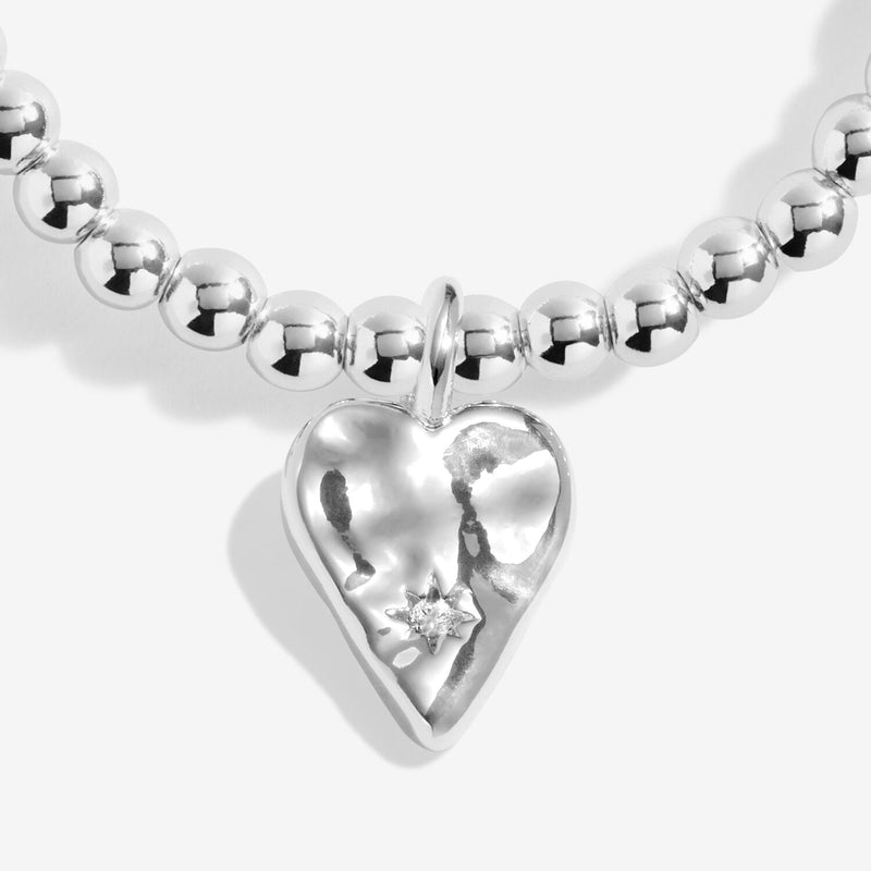 Close-up of Joma Blessed bracelet hammered heart charm