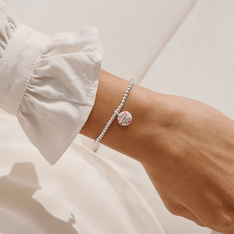 Joma Jewellery colourful disco ball bracelet worn on a wrist