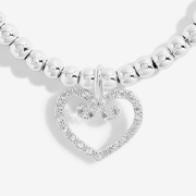 Close-up of Joma Excellent Eighty bracelet with a sparkling heart charm