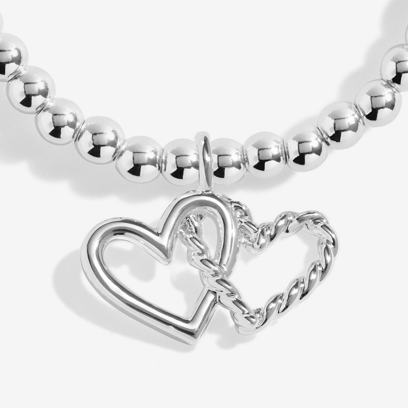 Close-up of the interlocking hearts on the Joma Fabulous Friend Bracelet
