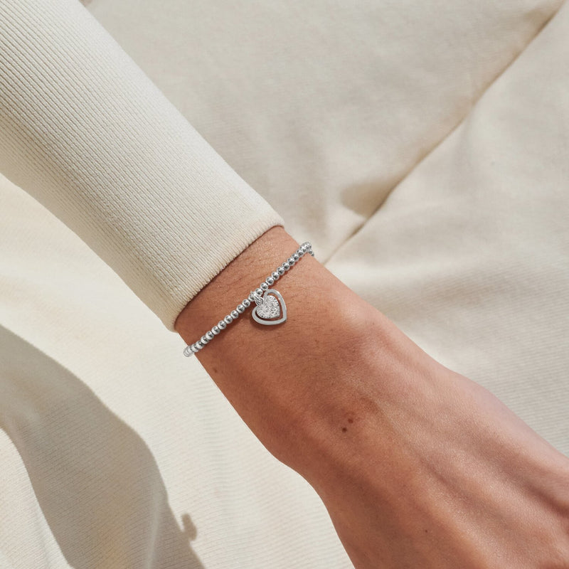 Silver-plated Joma Jewellery beaded Bracelet worn on wrist with sparkling heart charm in open heart frame, First My Mum Forever My Friend.