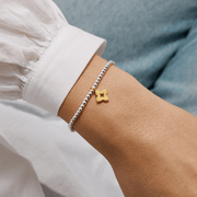 Joma Jewellery friendship flower bracelet worn on a wrist