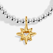 Close-up of Joma Good Energy bracelet star charm