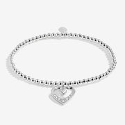 Full view of the Joma Jewellery A Little Happy Mother’s Day Bracelet, silver-plated beaded stretch Bracelet with heart charm.