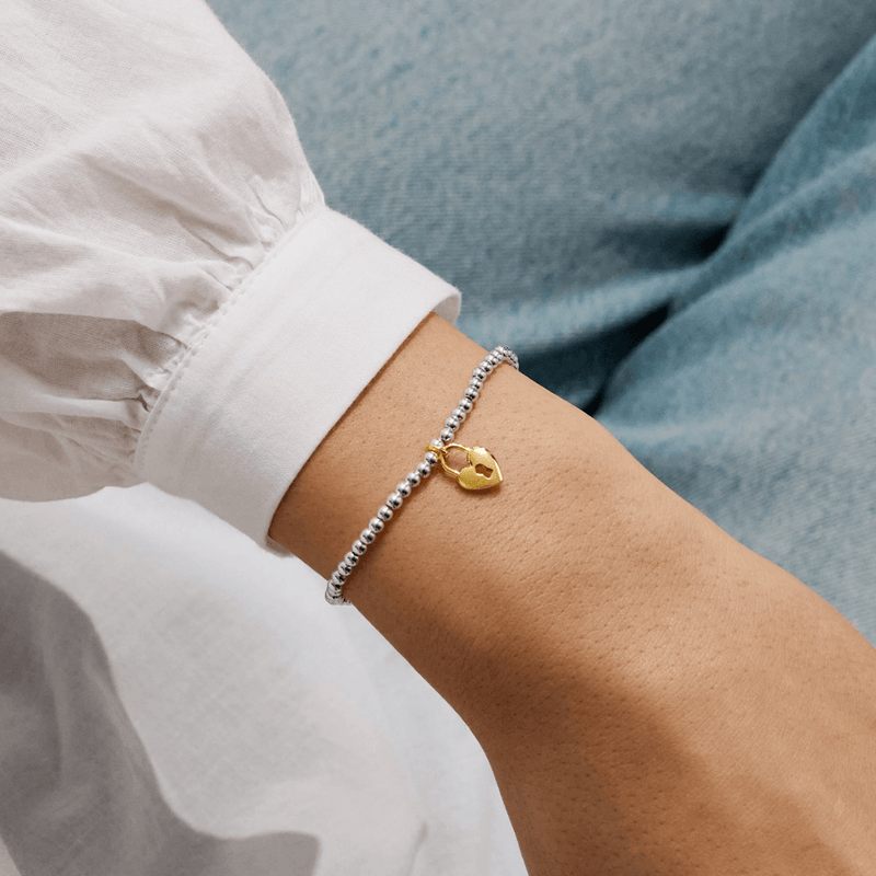 Joma Jewellery heart padlock bracelet worn on a wrist