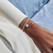 Silver-plated Joma Jewellery beaded Bracelet worn on wrist with daisy charm and heart crystal centre, Mother’s Day gift for Mum.