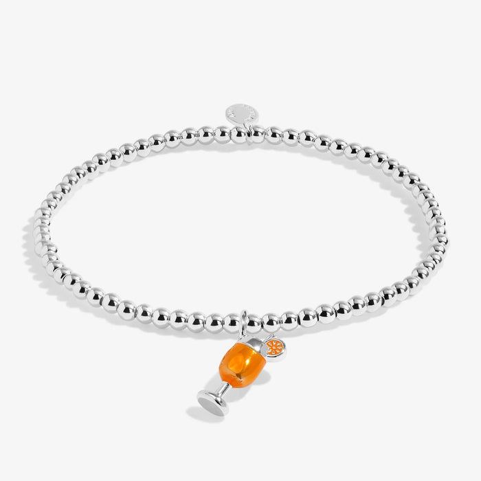 Joma silver-plated stretch Bracelet with orange spritz charm displayed on a white background
