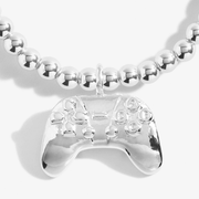 Close up of the Joma Jewellery A Little Girl Gamer silver plated bracelet with game controller charm
