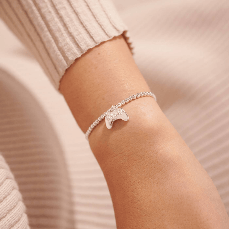 Joma Jewellery A Little Girl Gamer silver plated bracelet worn on wrist with game controller charm