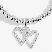 Close-up of Joma Happy Birthday Friend bracelet double heart charm