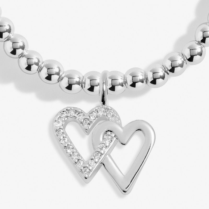 Close-up of Joma Happy Birthday Friend bracelet double heart charm