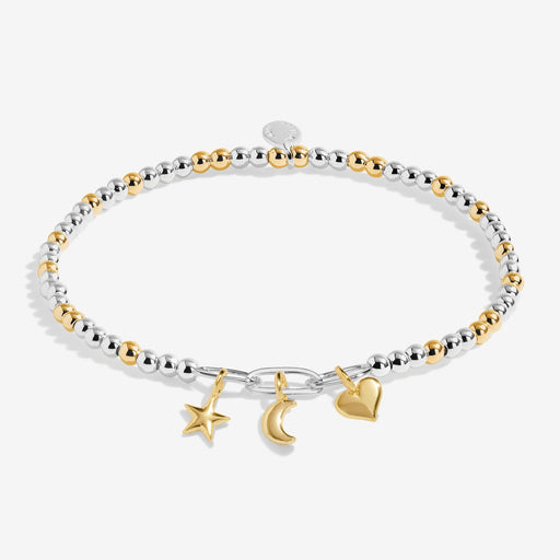 Two‑tone silver & gold beaded bracelet with star, moon and heart charms on white background.
