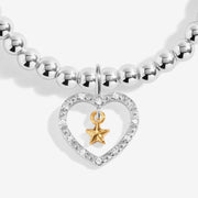 Close-up of Joma Best News Ever bracelet heart and star charms