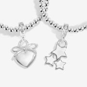 Close-up of Joma Merry Christmas bracelets heart present and star charms