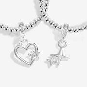Close-up of Joma Christmas Wishes bracelets heart and star charms