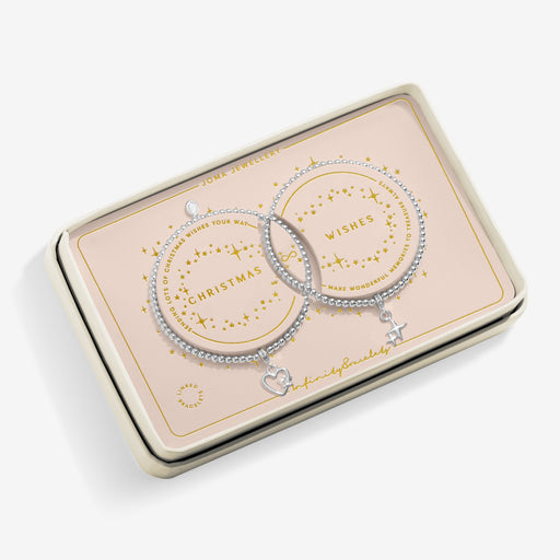 Blush tin showing Joma Jewellery linked Christmas Wishes bracelets – perfect Christmas gift for her.
